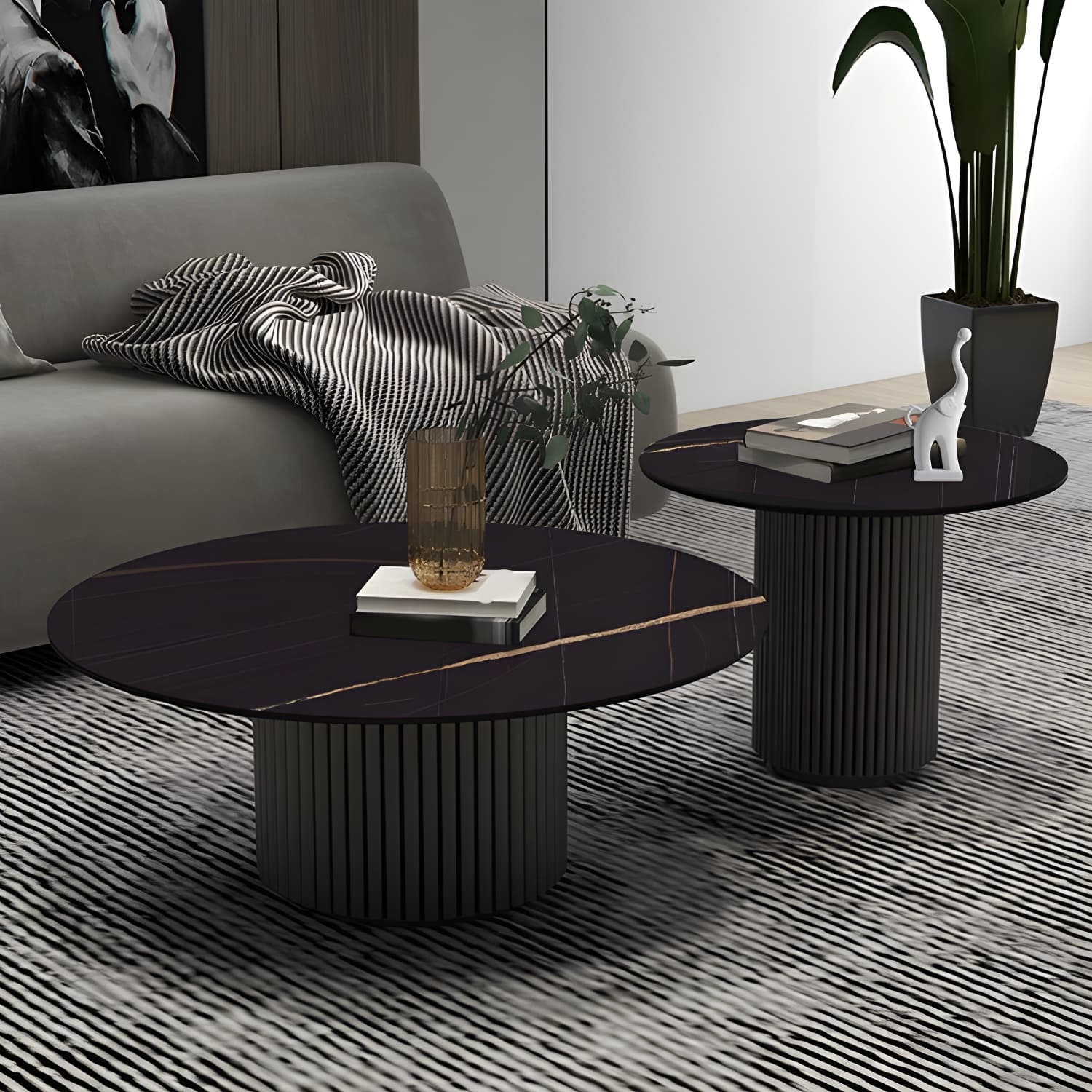 Set of Two Modern Round Black Coffee Tables with White Stone Tops and Iron Pedestal Bases - image 3