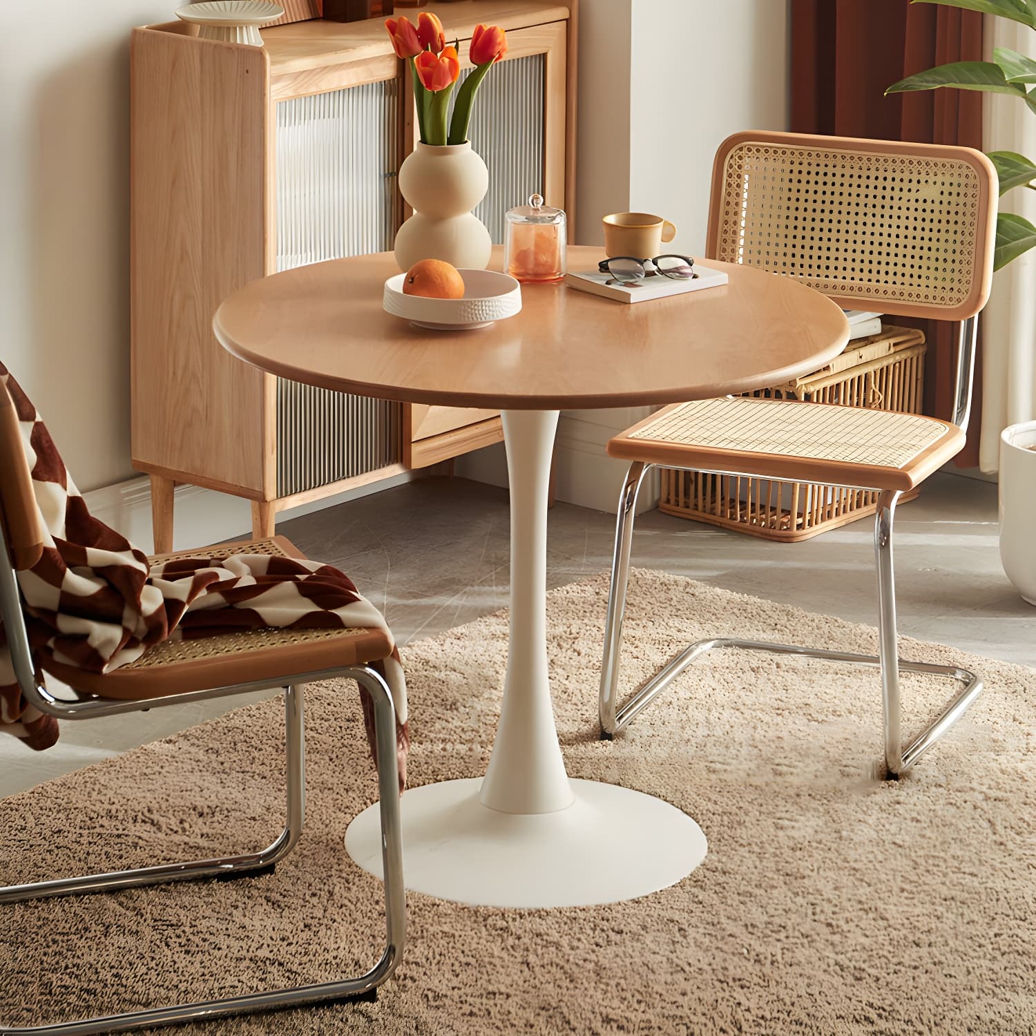 Chic Round Wood Dining Table with Medium Wood Tone and Sleek Steel Tulip Base - image 4