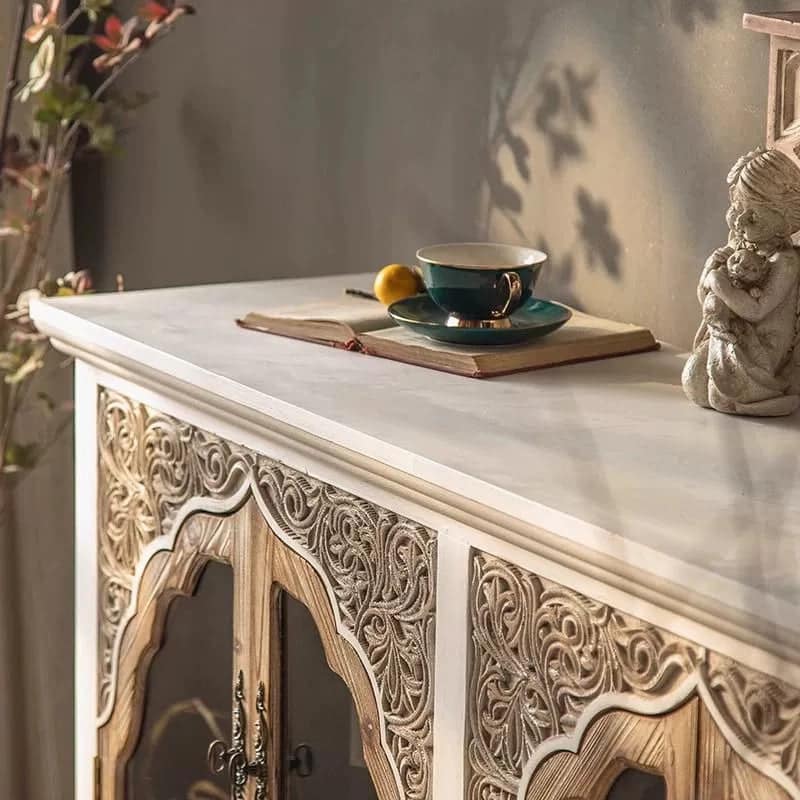 close_up_carved_fir_wood_sideboard_top_teacup_angel_sculpture.jpg Close-up of