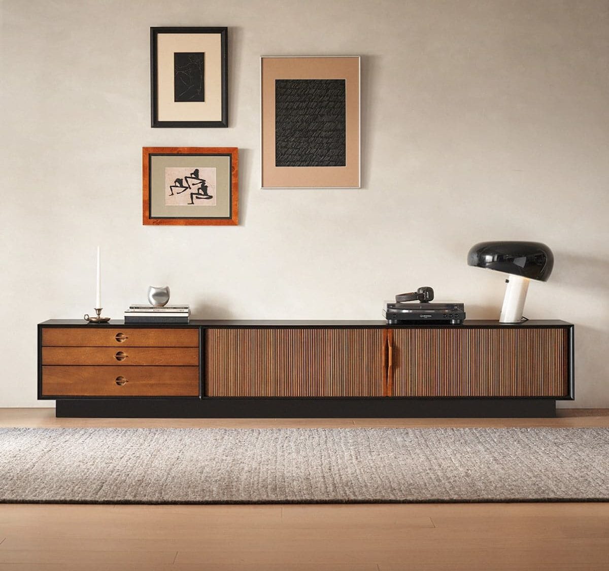 low_profile_boxwood_tambour_tv_stand_front_view_with_art_wall.jpg Low profile brown and