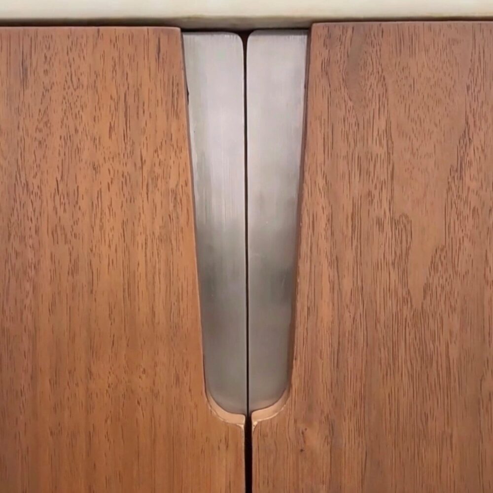 stainless_accent_between_walnut_doors_oval_sideboard.jpg Modern luxury oval walnut sideboard