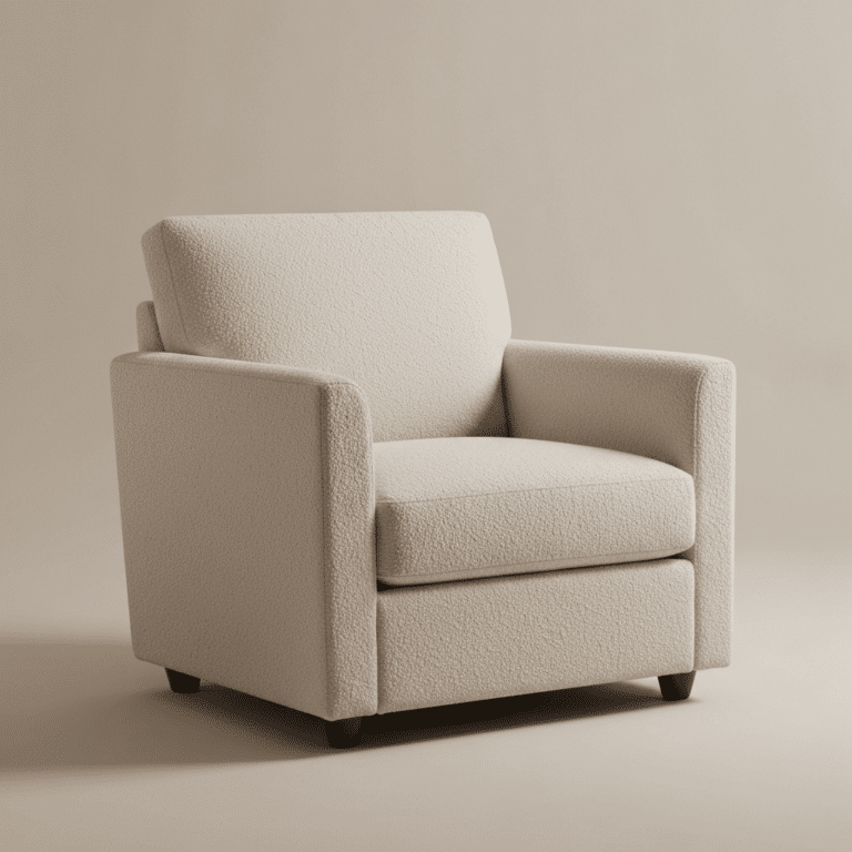Ormau modern cream bouclé fabric armchair with square armrests and dark wooden block feet.
